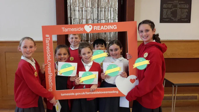 A photo of pupils from St Christopher’s Primary School in Ashton at the Reading Champions Celebration event at Dukinfield Town Hall.