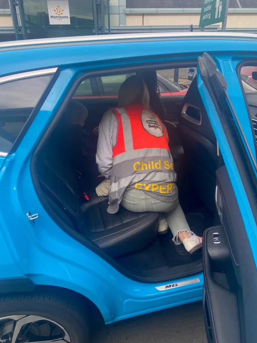 Good Egg Safety Officer carrying out a child car seat check in a car