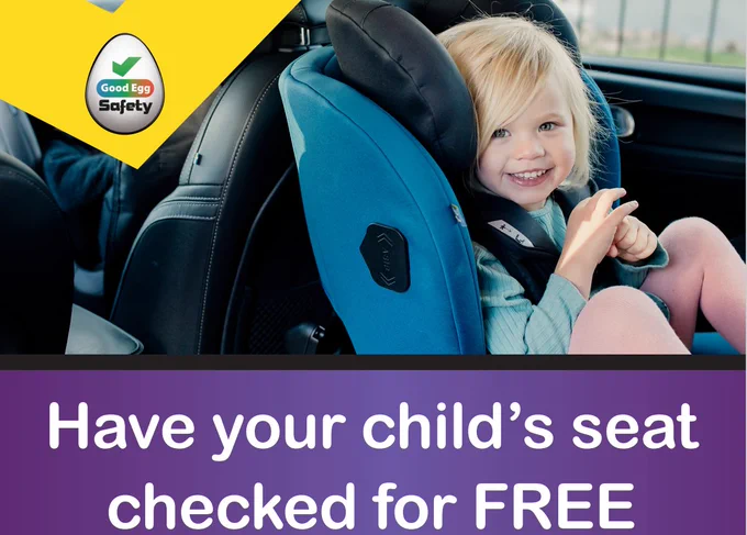 Infant child in a car seat with the wording 'Have your child's car seat checked for free'