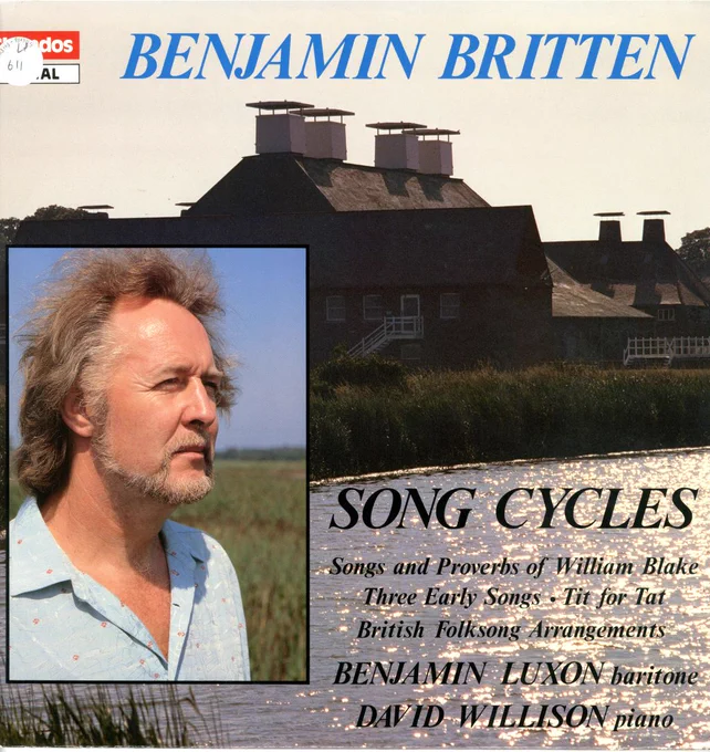 The cover of an LP of song cycles by Benjamin Britten, performed by Benjamin Luxon (baritone) and David Willison (piano).  The cover shows Snape Maltings silhouetted against strong summer sunlight, the river sparkling in front of it; in an inset, Luxon is photographed in an open-necked shirt gazing into the distance over reedbeds, his long hair tousled by the breeze.