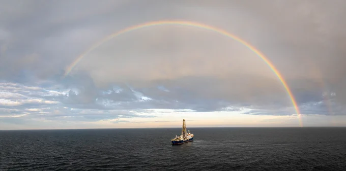 A drone captures a beautiful image of the JOIDES Resolution surrounded by a rainbow. (Credit: Chris Lyons & IODP)