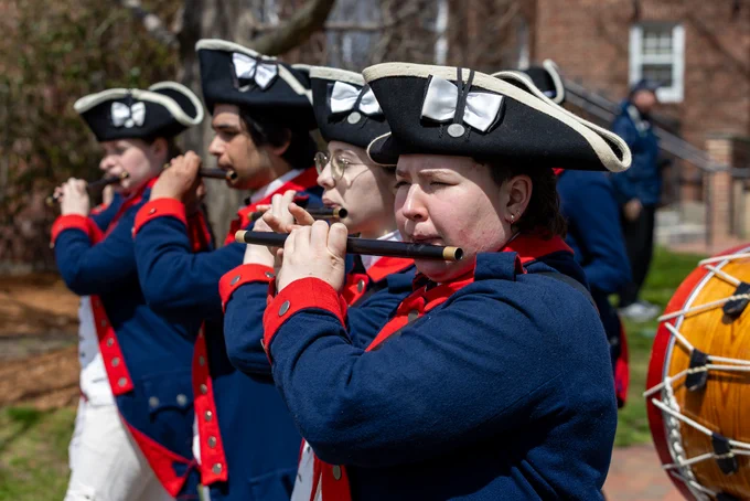 Revolution reenactors playing flute.