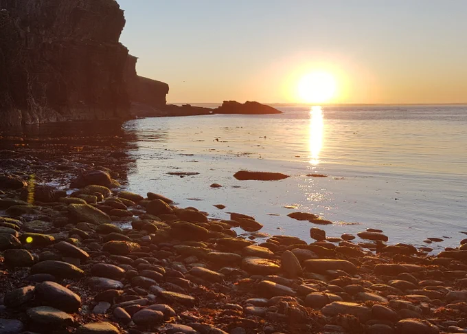 A beach at sunset