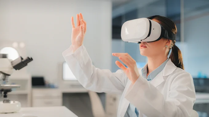 Woman in lab coat using a virtual reality headset. 