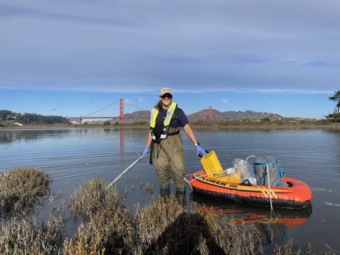 Research Hydrologist Laura Hubbard samples water near the Golden Gate Bridge in San Francisco, California.