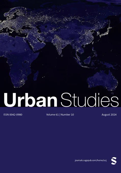 Urban Studies Journal cover. White heading text reads “Urban Studies” and issue details are listed in text below. Background is a map of the world at night with illuminated lights.