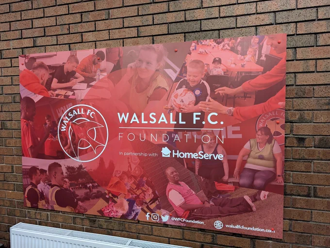 Image of Walsall FC Foundation Promotional material on the wall