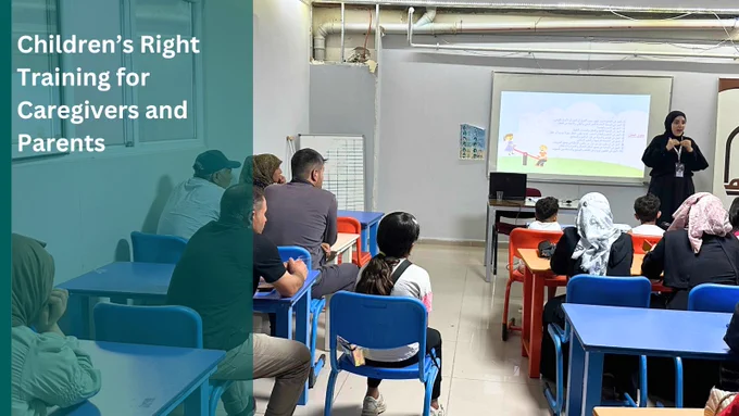 male, female and child participants sitting in a class room listening to an instructor who is presenting on the board.