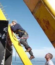 C Taggart claiming on the a-frame of a fishing trawler, Scotian Shelf 2007 