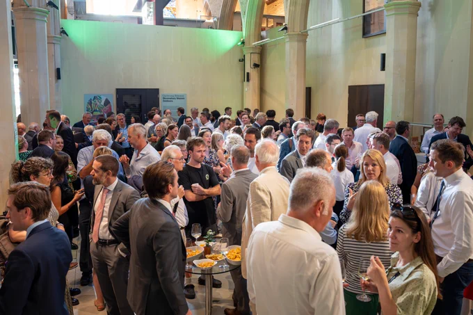 Group of people talking at an event
