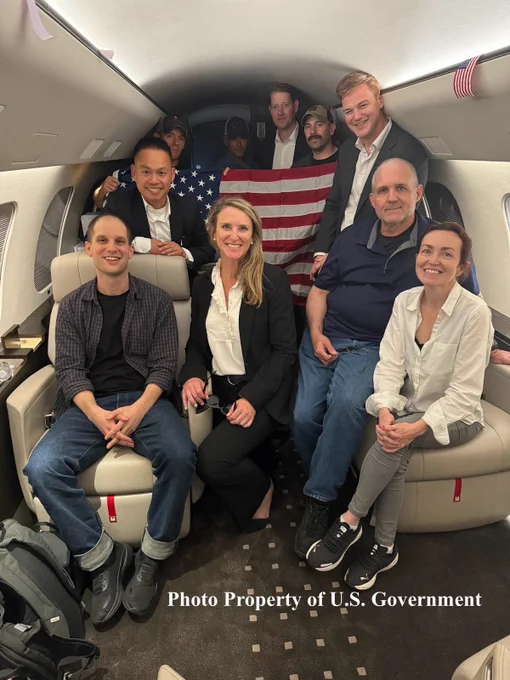Americans previously detained in Russia are pictured on a plane.