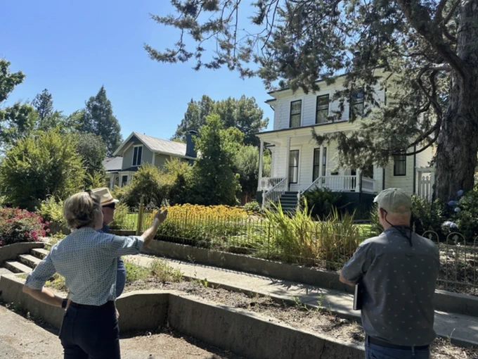 Yana Valachovic, University of California Cooperative Extension forest advisor, discusses home-hardening options with homeowners in Nevada County. Photo by Katie Low