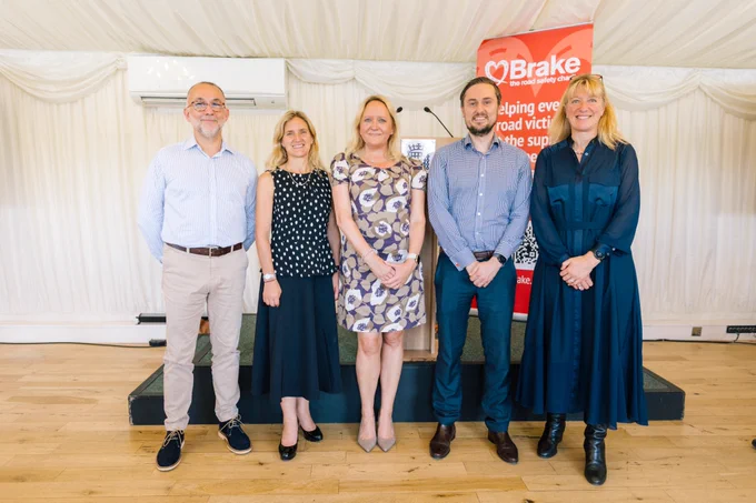 Speakers from Brake's Annual Reception stand shoulder to shoulder to pose for a photo at the event. Left to right are Campaigner Ian Greenwood, MP Kim Leadbeater, Brake chair of trustees Deborah Sleightholme, Brake CEO Ross Moorlock and Jo Shiner, Chief Constable Sussex Police and National Police Chiefs’ Council lead for Roads Policing.