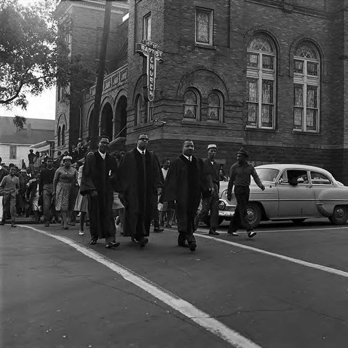 Reverends Nelson H. Smith, John Porter, and A. D. King leading marchers during a civil rights demonstration in downtown Birmingham, Alabama. Photo by Robert Adams, courtesy of the Civil Rights Digital Library.