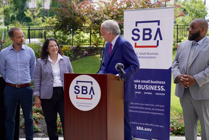 Senator Markey speaks at a podium with an SBA logo and signage and introduces Administrator Guzman. Two others are in the background