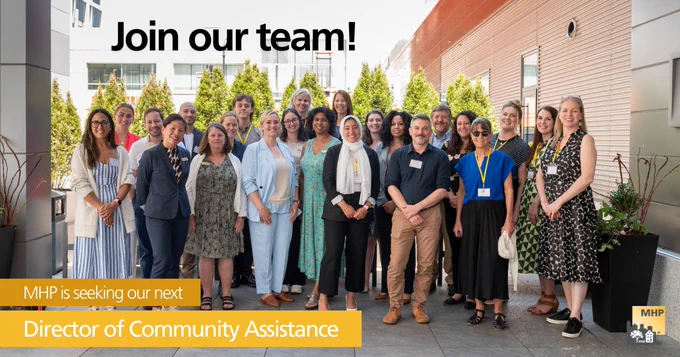 A group of 20  people smile for a photo. The words, "Join our team!" and "MHP is seeking our next Director of Community Assistance" 