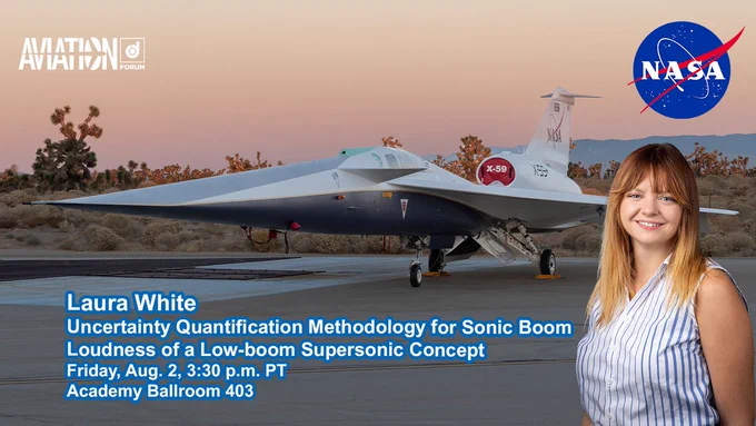 A smiling woman in a striped, sleeveless top stands in front of a photo of a supersonic concept aircraft parked on a tarmac in the desert. There   are cacti and mountains in the background with a sunset in various shades of orange.
