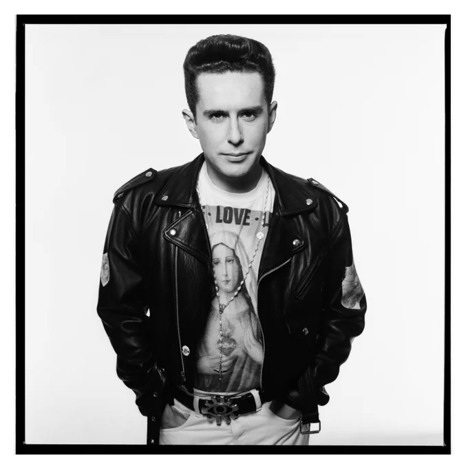 Black and white portrait of Holly Johnson wearing  a leather jacket and a t-shirt.
