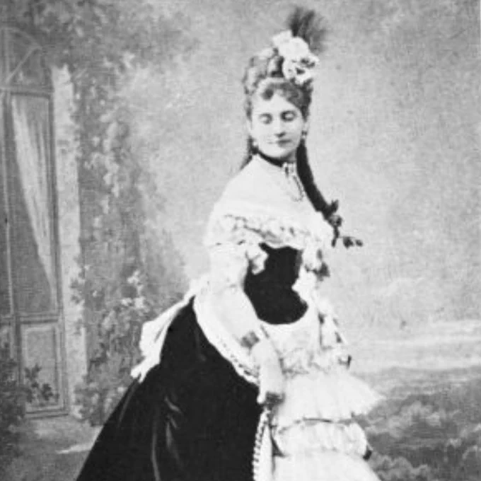 Hélène de Pourtalès  wearing a dress