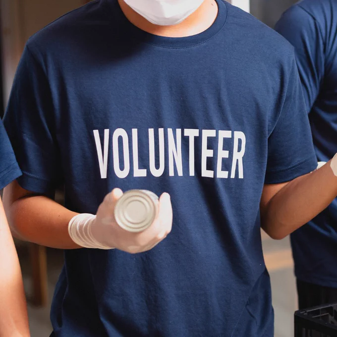 Person with volunteer on their shirt 