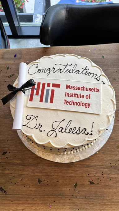 Photo of a graduation cake that says Congratulations Dr. Jaleesa, with the Massachusetts  Institute of Technology logo in the middle.