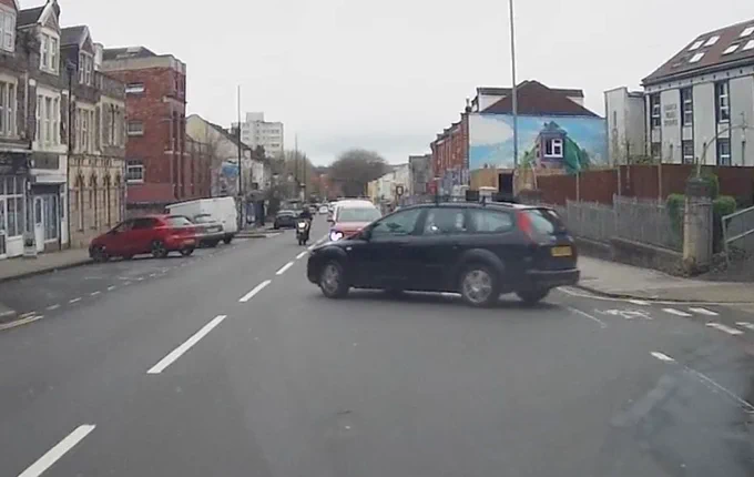 Motorcycle moves to wrong side of road to overtake