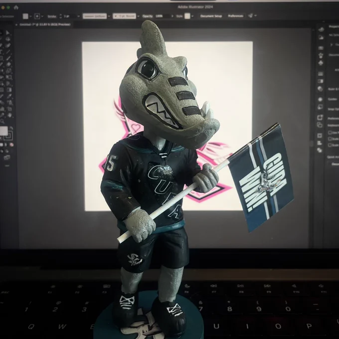 Frenzy Bobblehead in front of a computer screen
