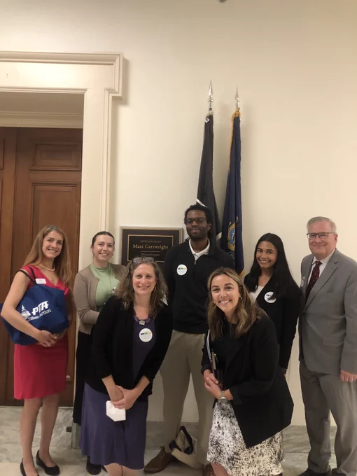 NAfME advocacy staff Zach Keita with CEF staff outside Rep. Cartwright's office with staff. 