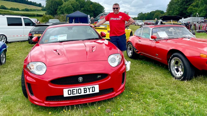 Alt Text - (alt="Creative Director, Paul, in attendance with his red Jaguar XKR ”) 