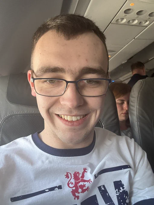 Laurie pictured on an aircraft looking at the camera.