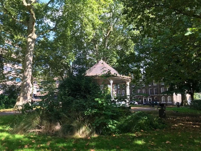 Northampton Square's bandstand and greenery on a sunny day