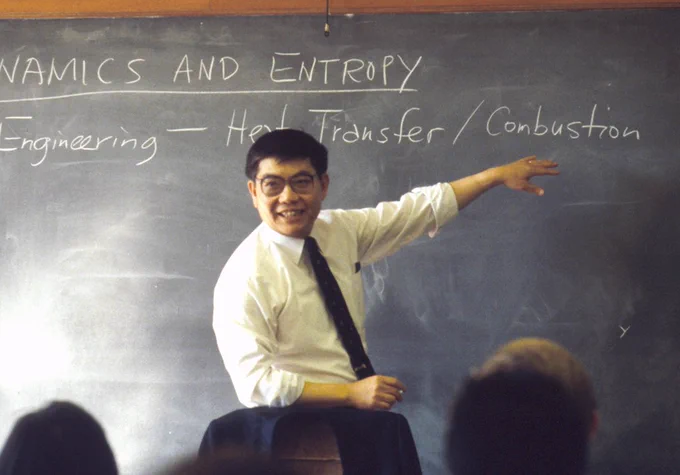 Chang-Lin Tien is pictured teaching in front of a chalkboard.