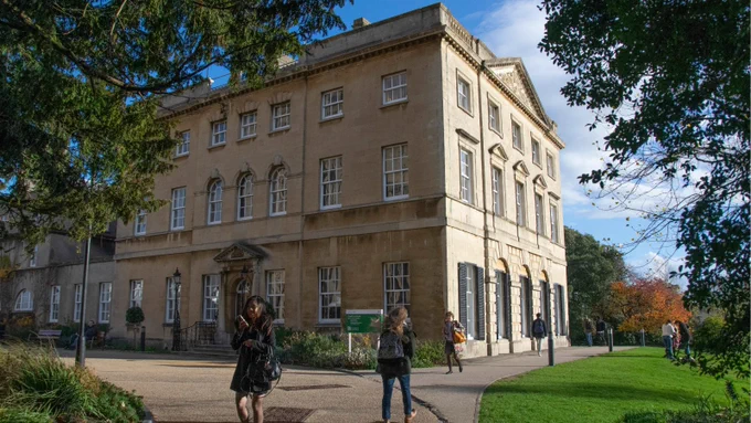 People walking in front of Royal Fort House