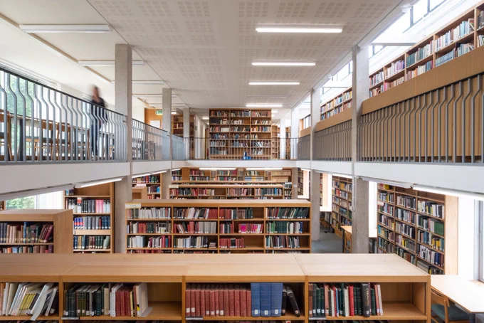 The second floor of the MMLL Library is seen from above the bookcases in the first-floor Spanish section.
