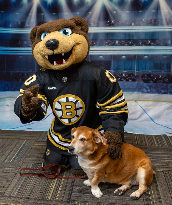 Blades posing with therapy dog Oliver