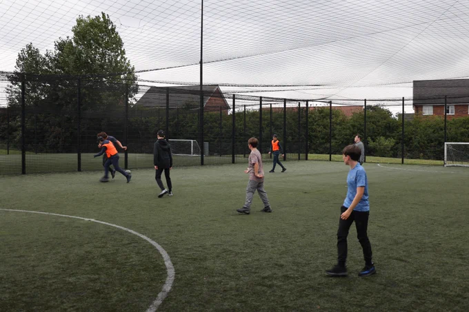 young boys playing football