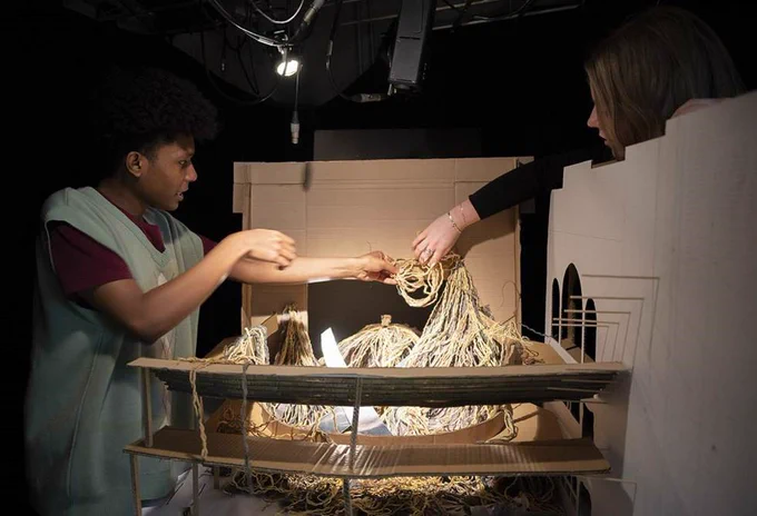 Design for Performance students working on a model box