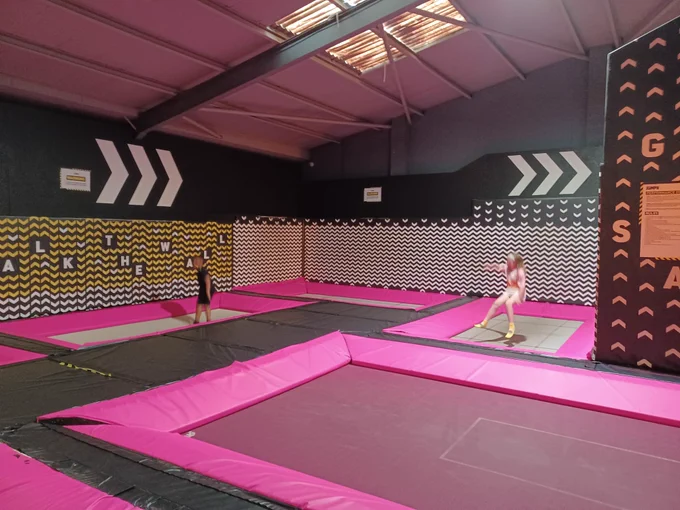 Two young people enjoying the trampolines.