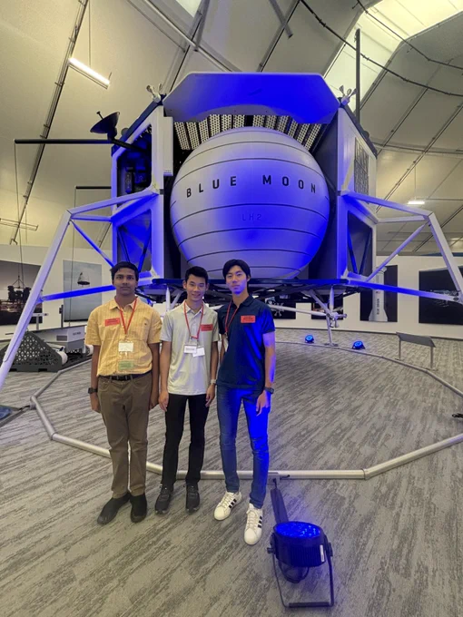 three people in front Blue Moon