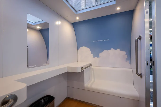Wide photo of MAMAVA pod showing interior with lights on