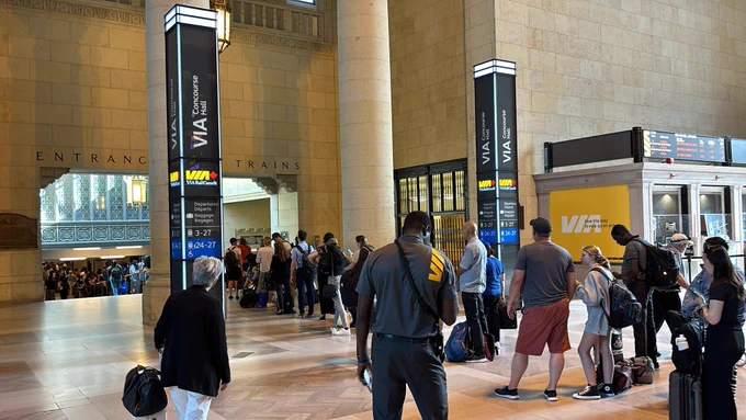 Train 54 lineup all the way out of the departures hall.