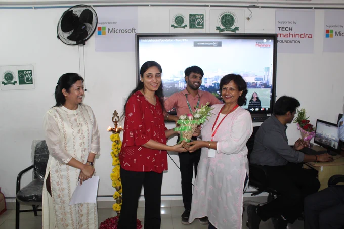 Sangeeta Bhowmick, IBU Head, Digital Engineering Services, Tech Mahindra, is welcomed by a SMART  student in Ahmedabad.