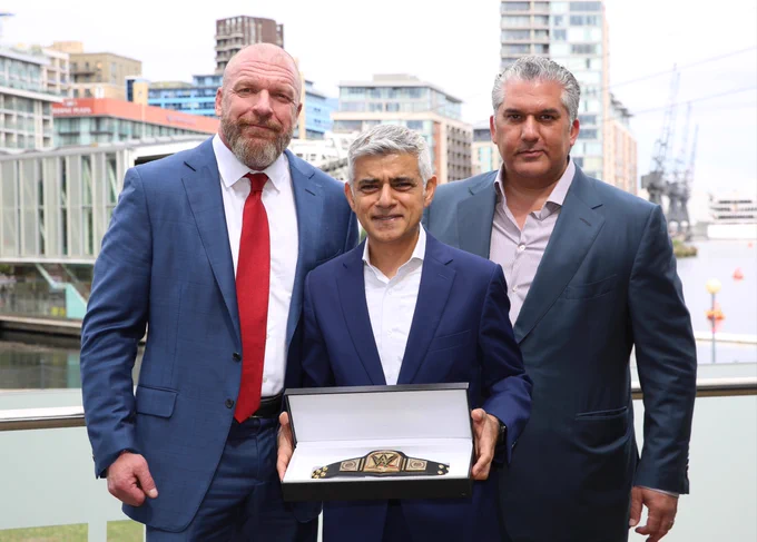 Mayor of London Sadiq Khan with Paul "Triple H" Levesque and WWE President Nick Khan holding a wrestling belt