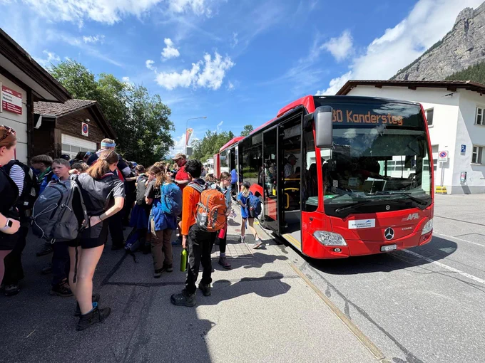 Scouts getting on a Swiss bus