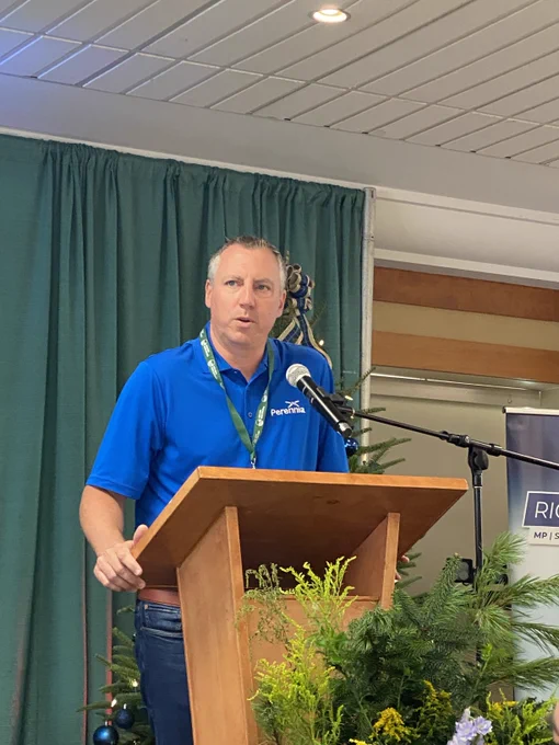 Minister Morrow,  the Minister of Agriculture in Nova Scotia, provides remarks at a podium.