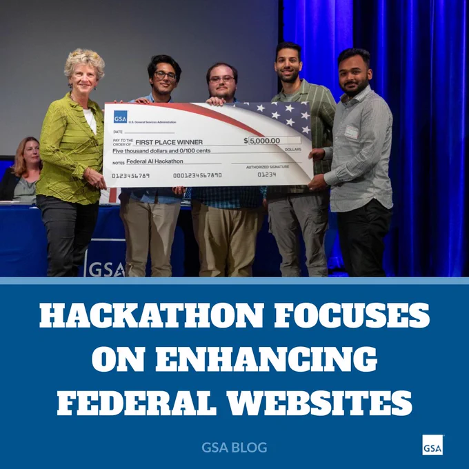 Photo of Administrator Carnahan posing for a photo with 4 people holding a a huge check. Text below reads: Hackathon focuses on enhancing federal websites. GSA Blog. The GSA StarMark is in the lower right corner.