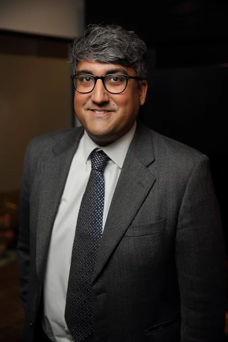 A portrait photo of Dr Minhas