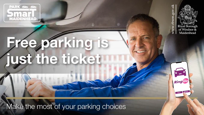 Image shows a person sitting in their car. Free parking is just the ticket.