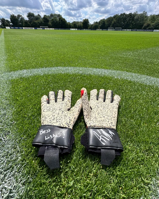 Signed Alex Palmer gloves on the training pitch.