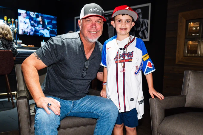 Baylor and Chipper Jones together inside Truist Park